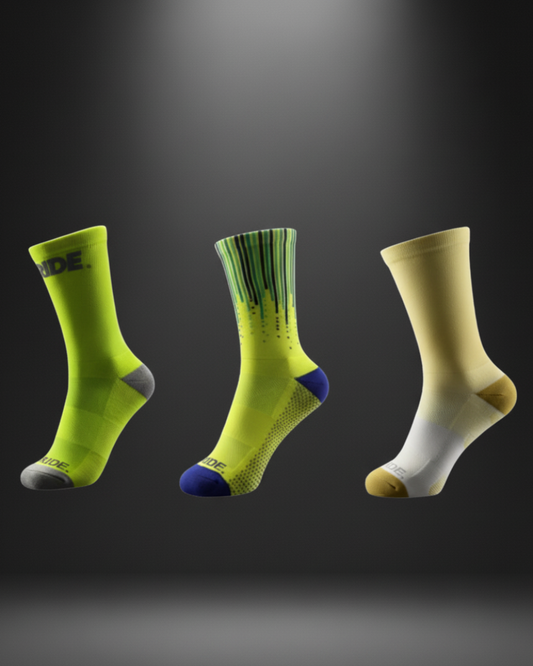 Three pairs of socks in different colors on a dark background