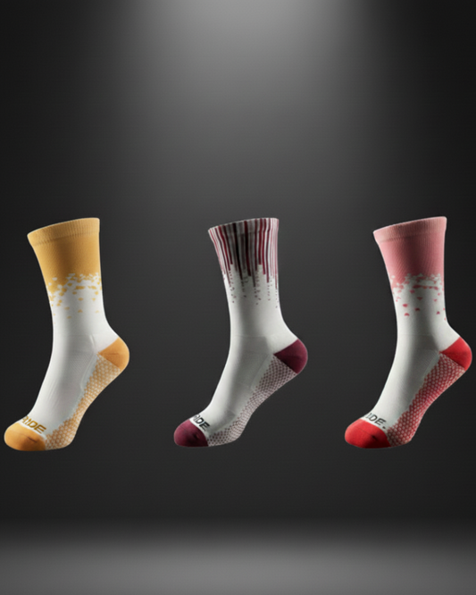 Three pairs of socks with different designs on a dark background
