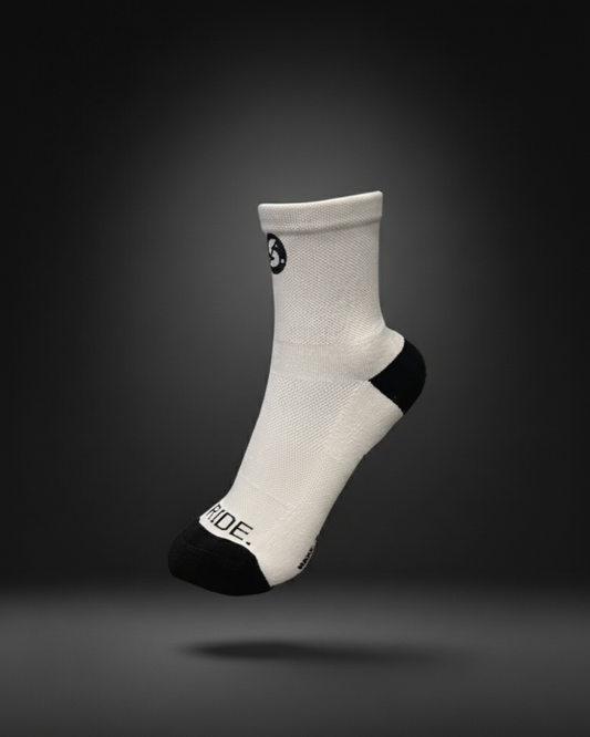 White sock with black accents on a dark gray background