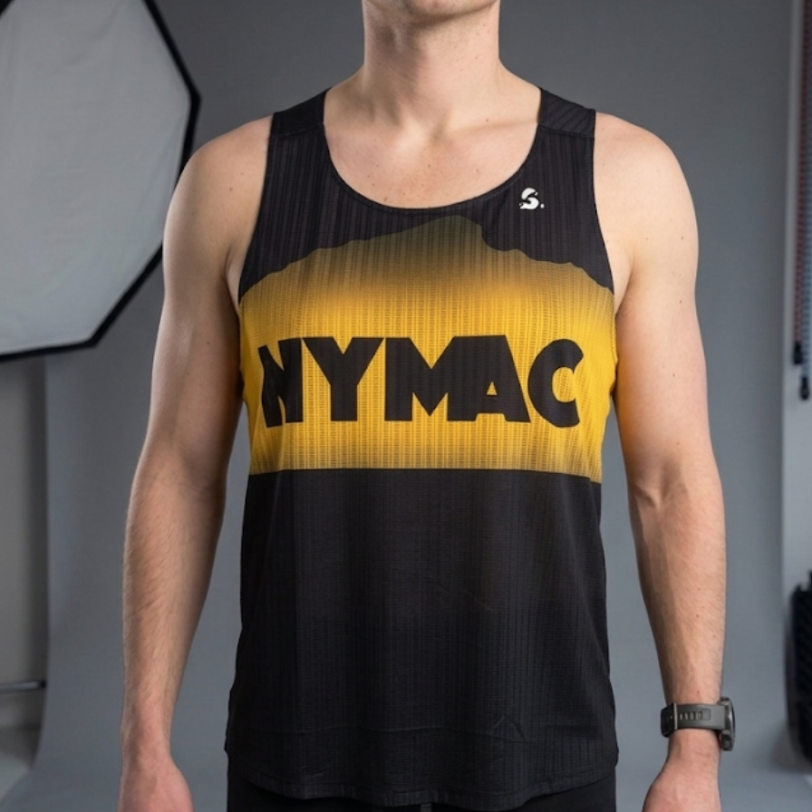 Person wearing a black and yellow tank top with 'NYMAC' branding, standing against a neutral background.
