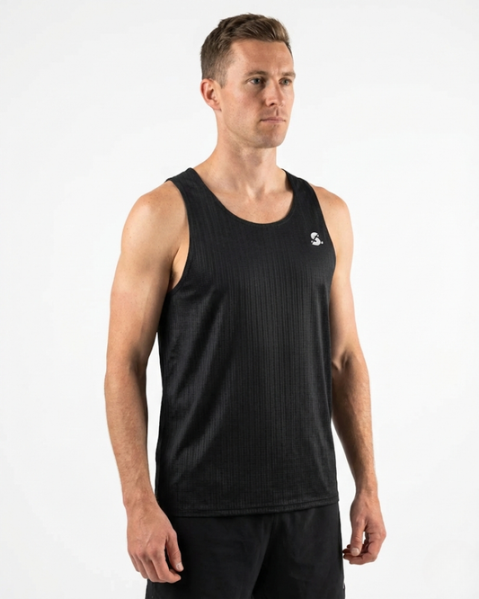 Man wearing a black tank top with a logo on a white background