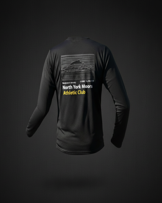 Black long-sleeve shirt with text on the back against a dark background