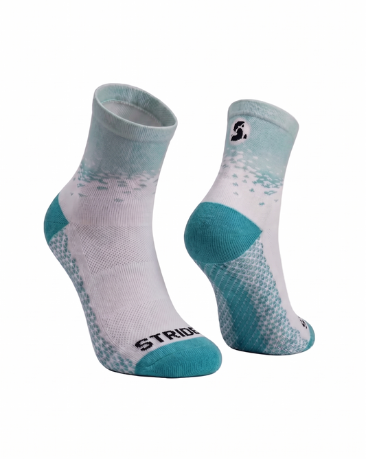 White and teal socks with 'Stride' branding on a white background