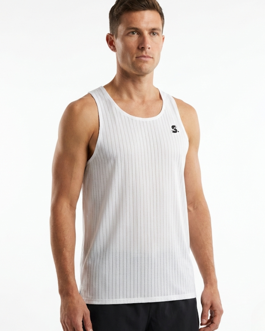 Man wearing a white tank top with a brand logo on a white background